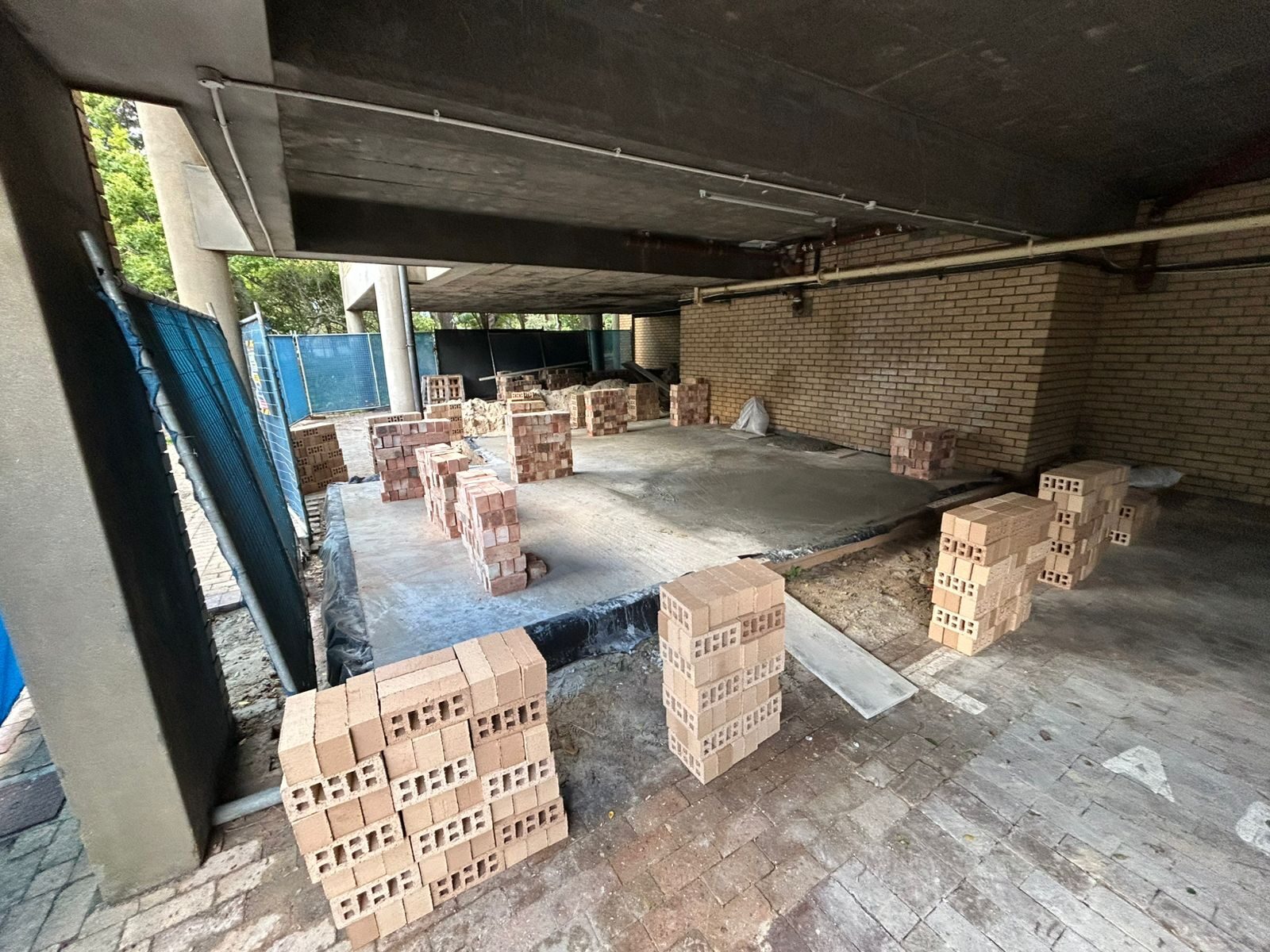 Bricks staged on site ahead of wall-building